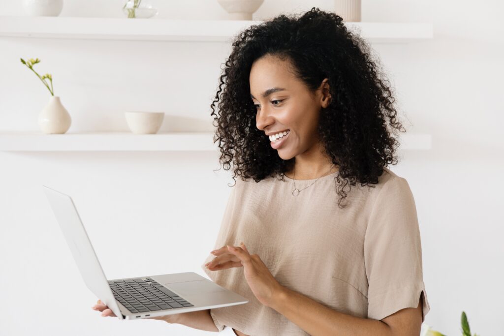 A woman using a laptop: outsourcing functions