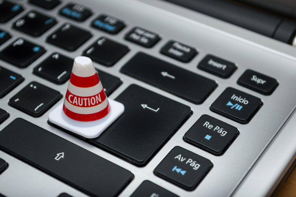 A laptop keypad with a caution pinecone on it