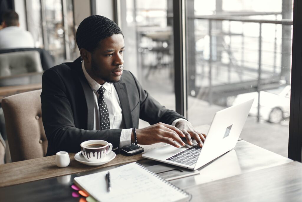 A person working with a cup of coffee: outsourced accountant