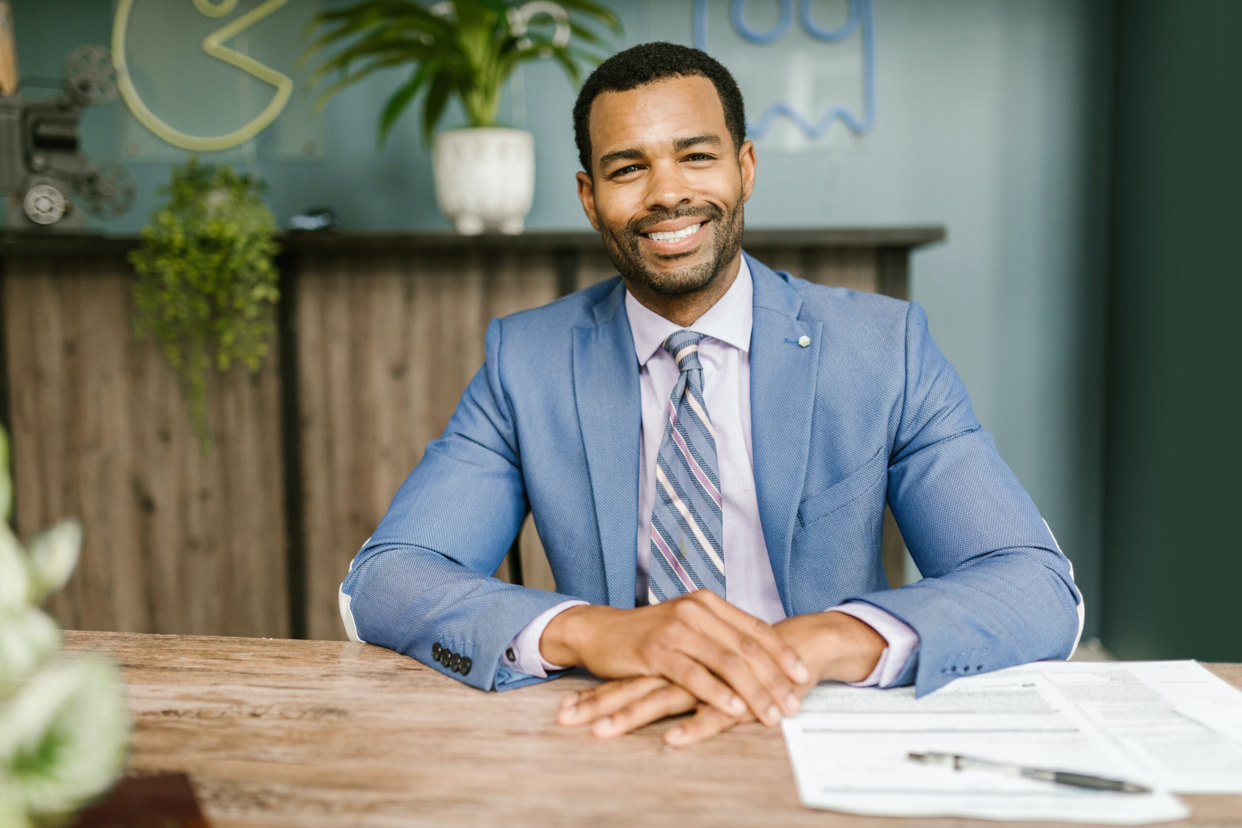 A smiling gentleman at a desk: outsourced accountant