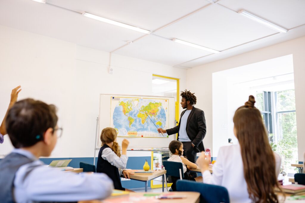 A teacher and children in the classroom