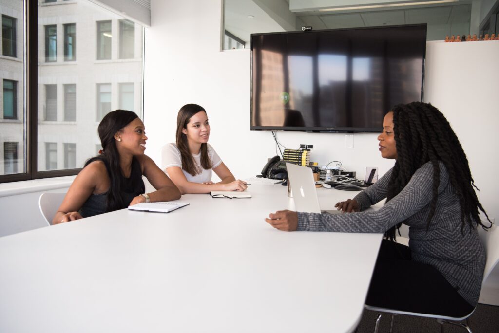A group of women having a discussion: outsourced communications