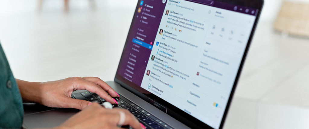 A woman typing on her laptop with Slack displayed on the screen: remote team