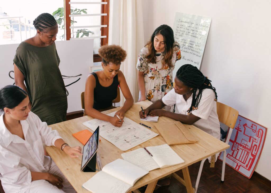A group of women at a meeting: outsourced project manager